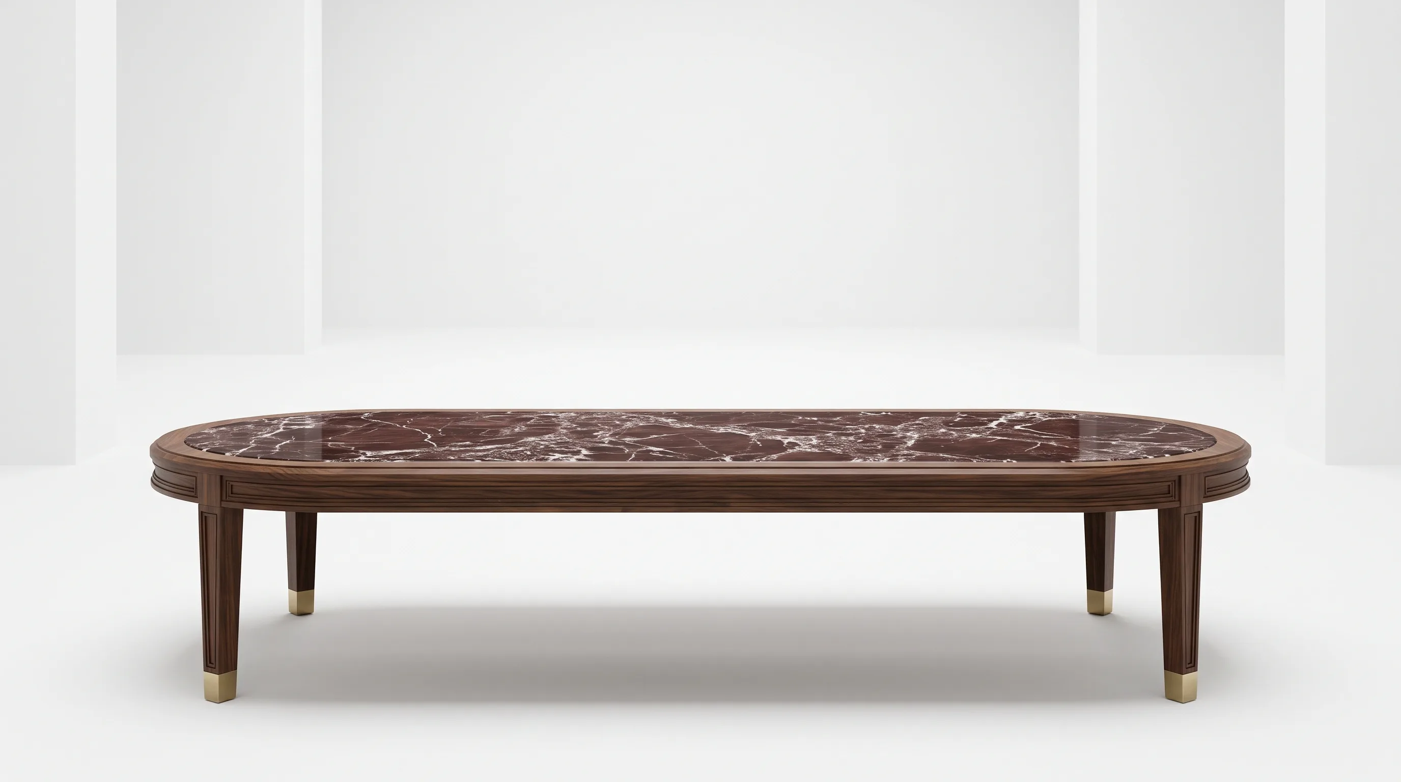 Oval Rosso Levanto marble and walnut coffee table against a white studio wall